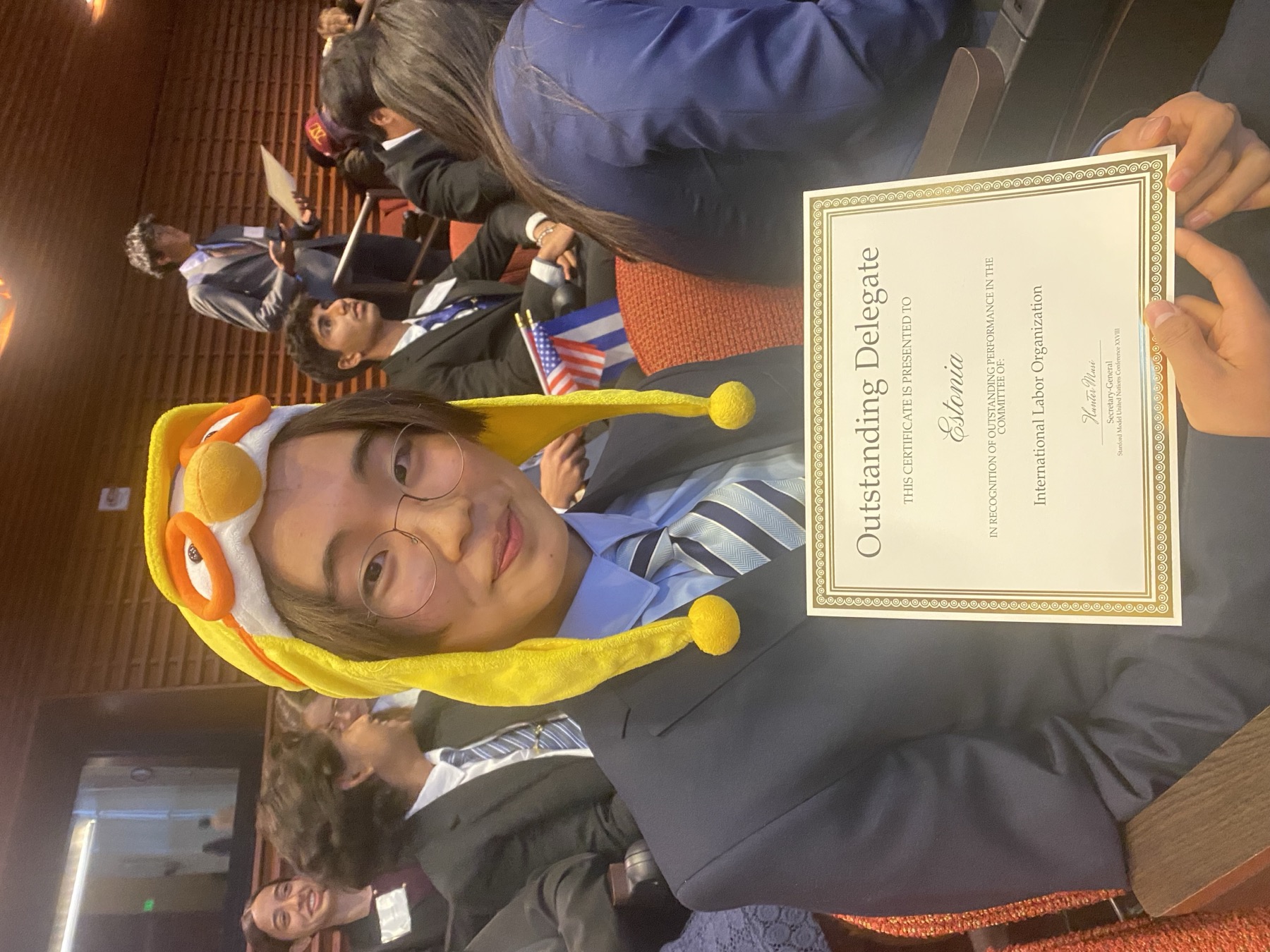 joshua holding an outstanding delegate certificate