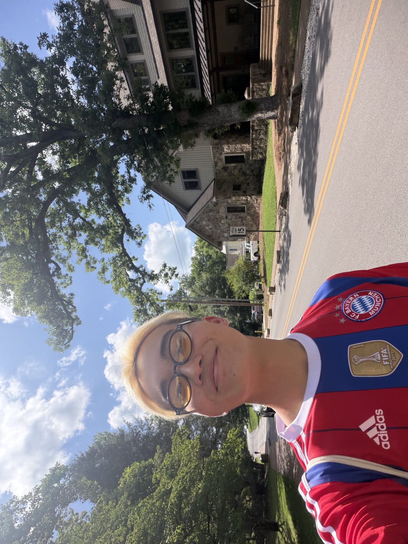 joshua in a soccer jersey outside